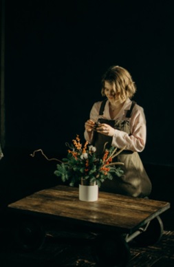 women taking care of flower at flower shop