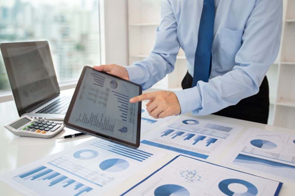 Man showing how a payroll software works