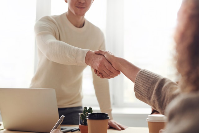 Man and Woman shaking hands for a new startup