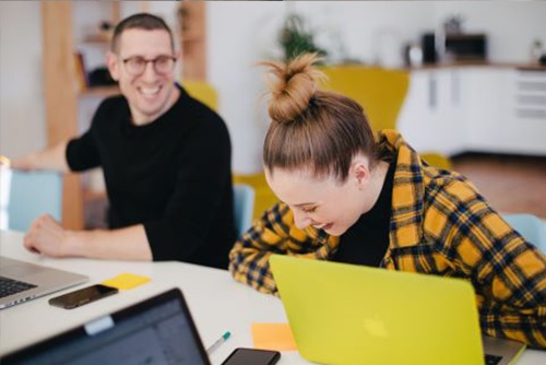 Employees laughing together