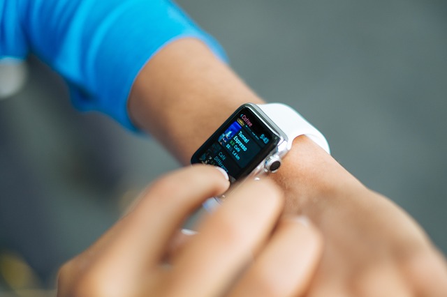 A student checking out some stuff on her smart watch.