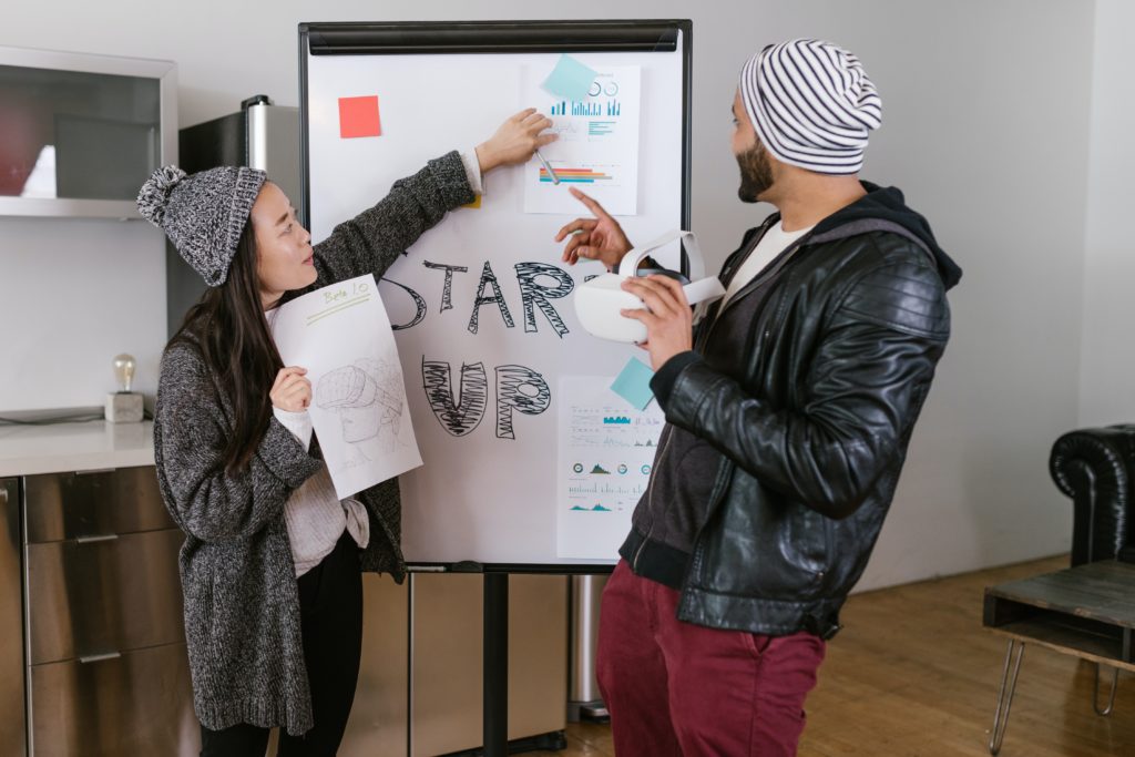 A man and woman talking about a startup company.