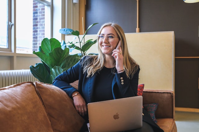 A Business Woman talking over the phone.