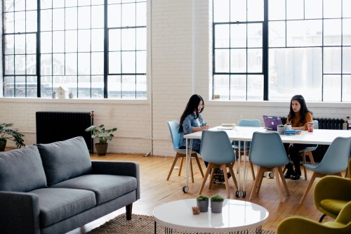 Coworkers working at shared in a community space 