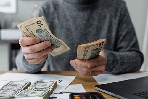 Person counting money