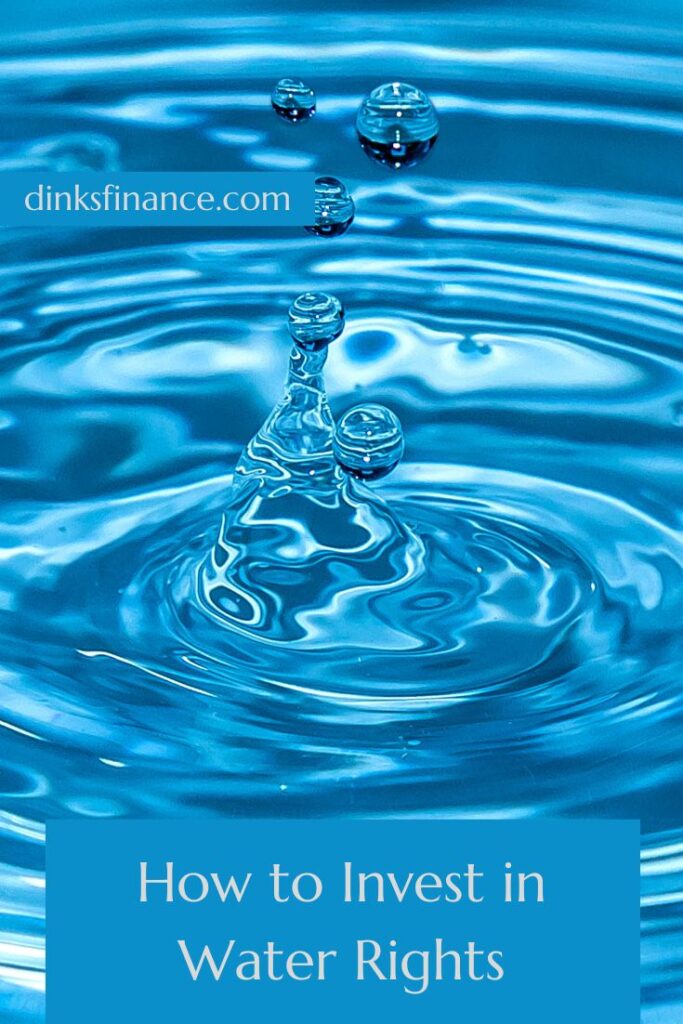 Drop of water falling into a large body of blue water