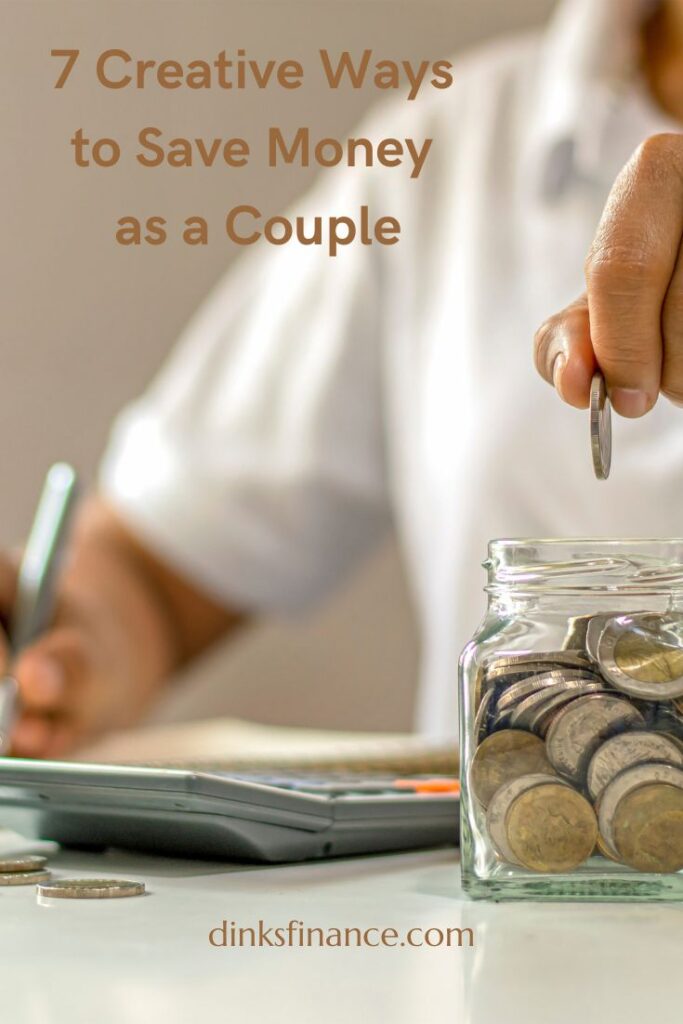 A person dropping coins in a jar with a calculator in front of him.