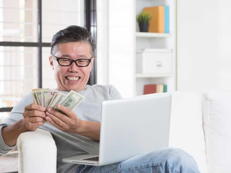 how to make money on fiverr - person counting his money