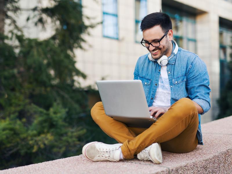 how to make money on fiverr - freelancer working on a laptop