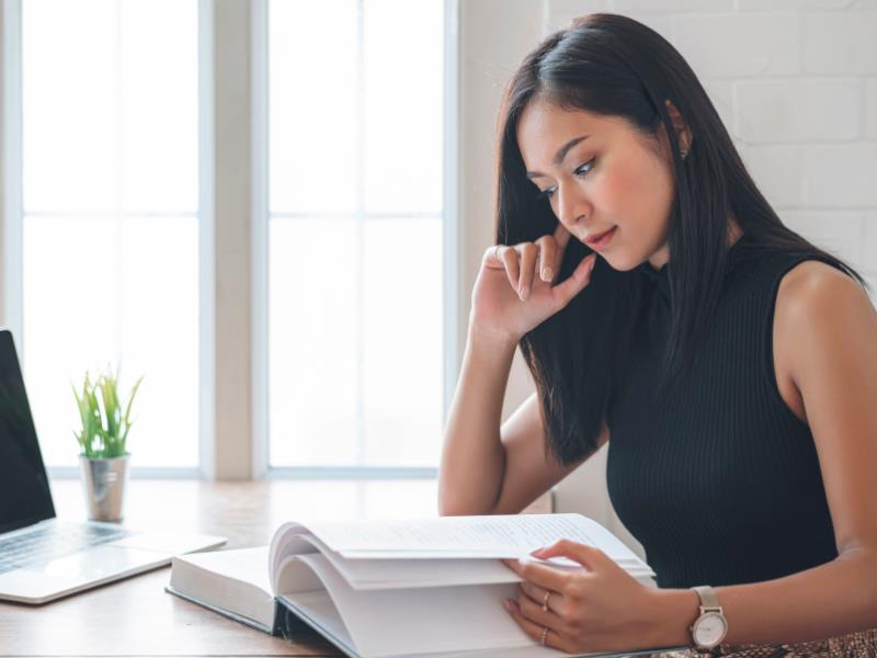 Business woman reading best business books