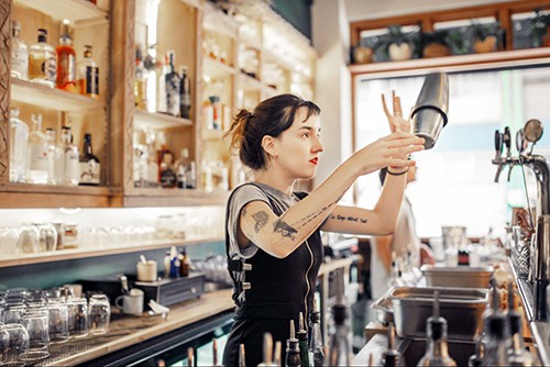 Woman making a cocktail